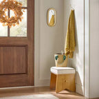 Specchio ovale con finitura in ottone
