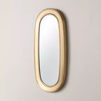 Specchio ovale con finitura in ottone